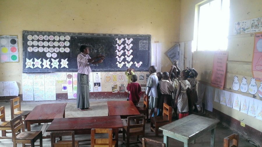 Teacher Grace guides the children at St. Anthony Pre-School through the morning lesson.