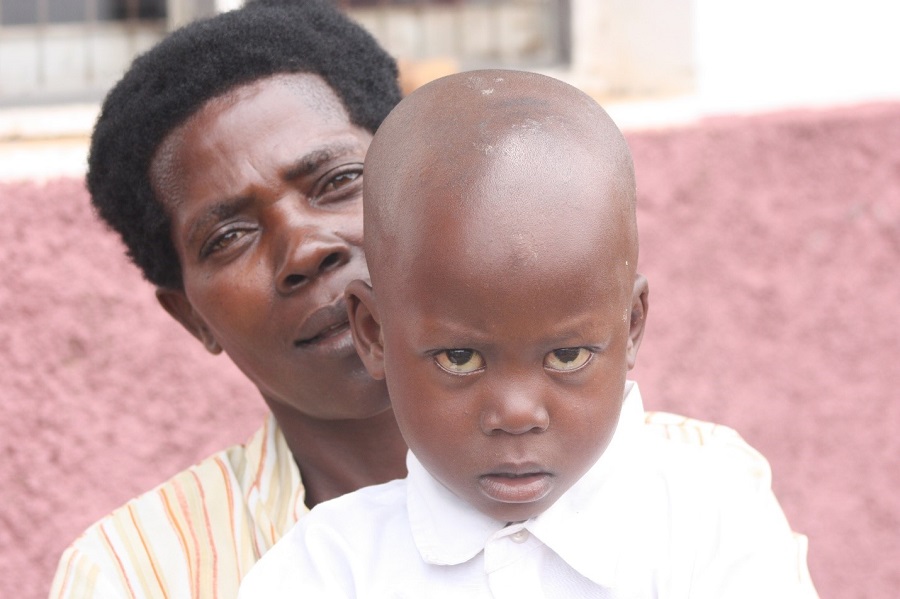 Grandma Nakitanda holds her grandson Ron Grandma Nakitanda holds her grandson Ron