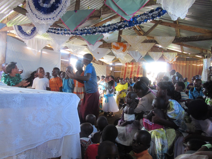an image of people gathered by an altar