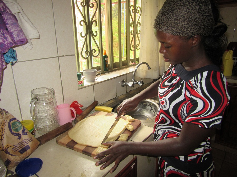 Teddy cutting Mandazi dough
