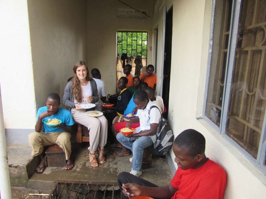 college intern having lunch with high school students