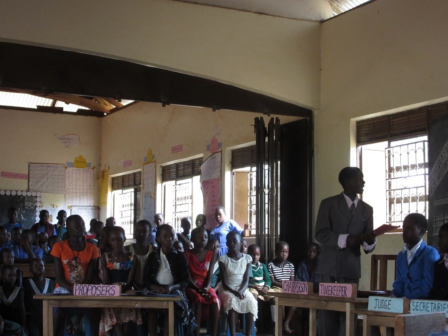 Students from Stella Maris in Primary Six (P6) present a debate about the proposal that "faithfulness and respect promote happiness and peace in the family".