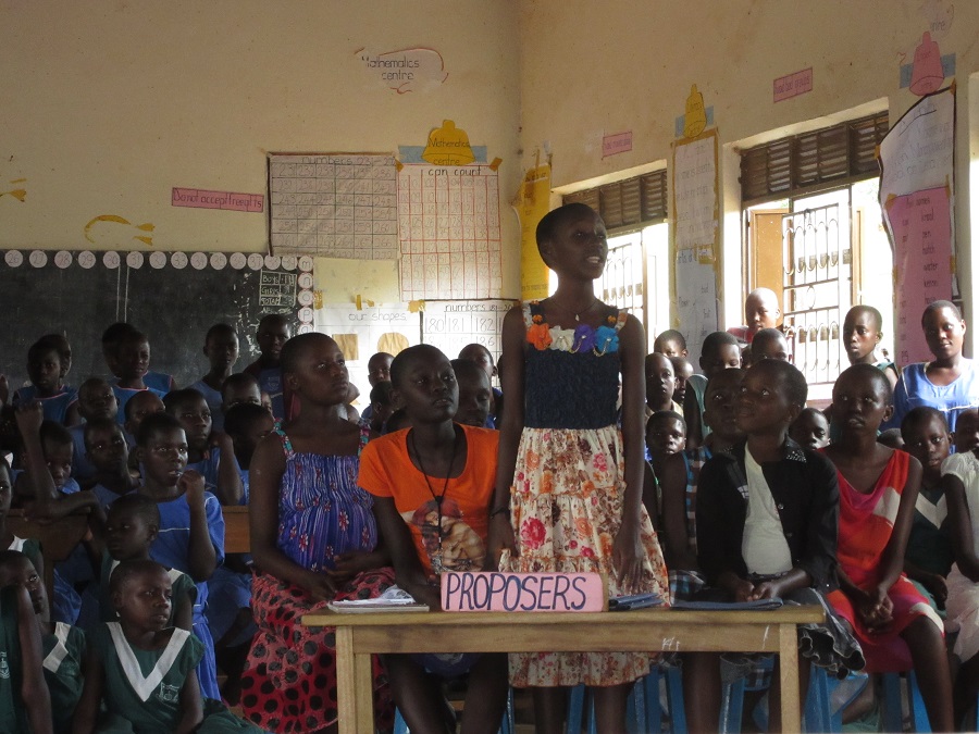 A Stella Maris student in P6 stands to present her views during the debate.