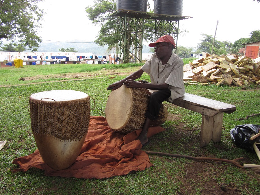 A local artisan repairs drums at Stella Maris Secondary School, where many supporters of CARITAS sponsor a child.