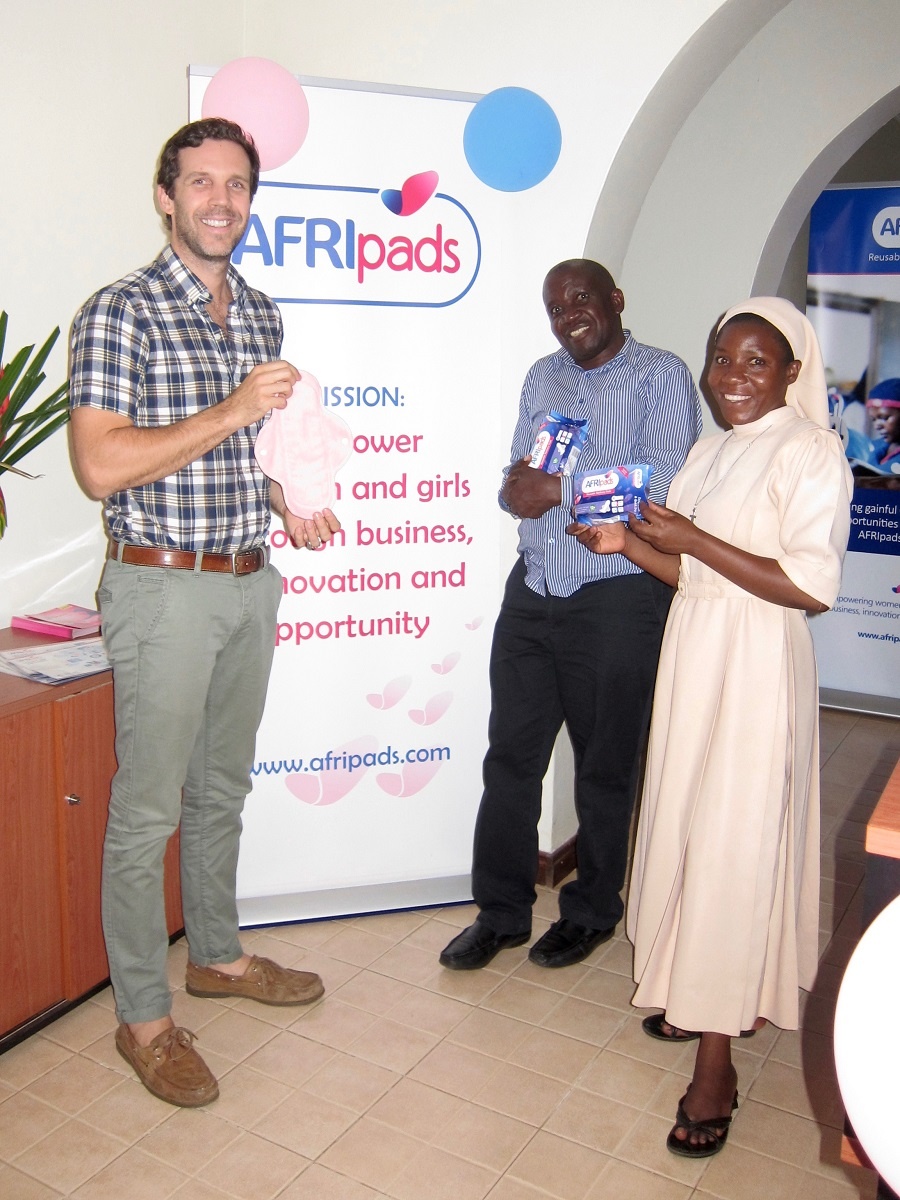 afripads founder with Joseph and Sister Carolyne.jpg