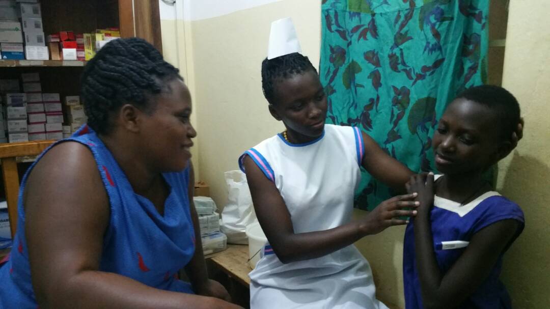 Lillian assisting patient.jpeg