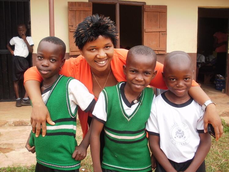 Catholic child sponsorship programs location coordinator with students
