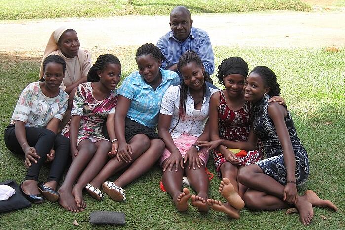 students with Sister Carolyne and Joseph on campus.jpg