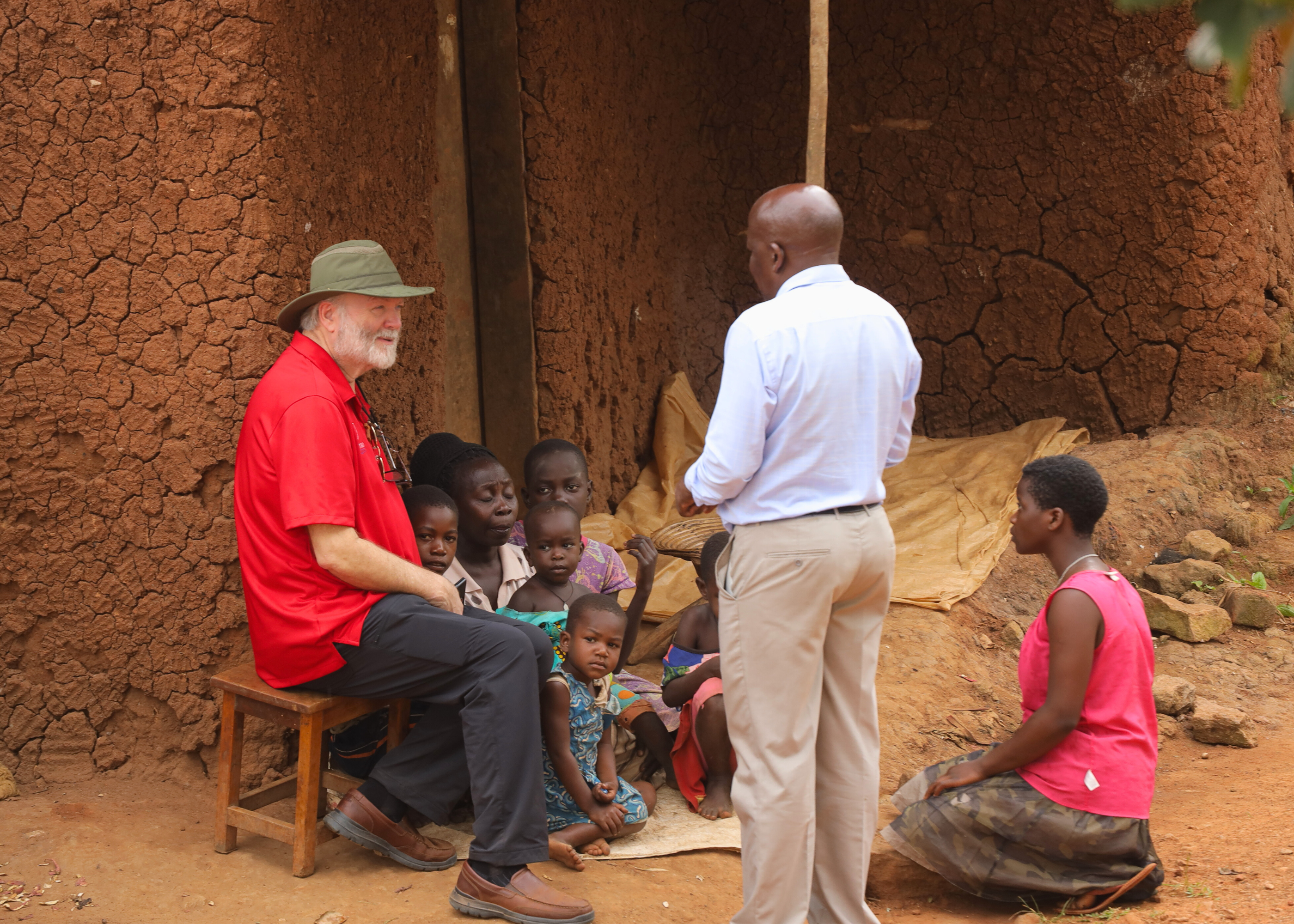 Chris with a family in Uganda